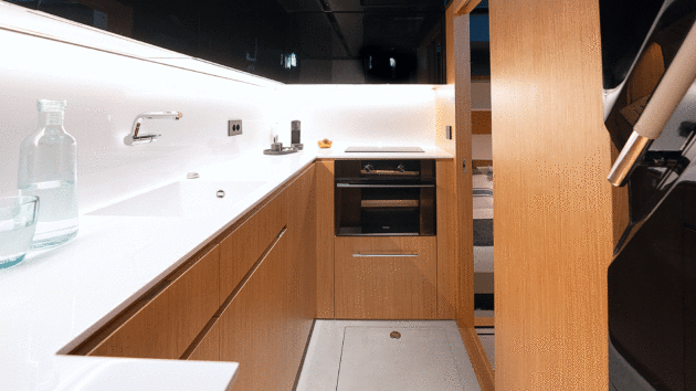 The port galley can be accessed from the saloon, as well as the lower atrium