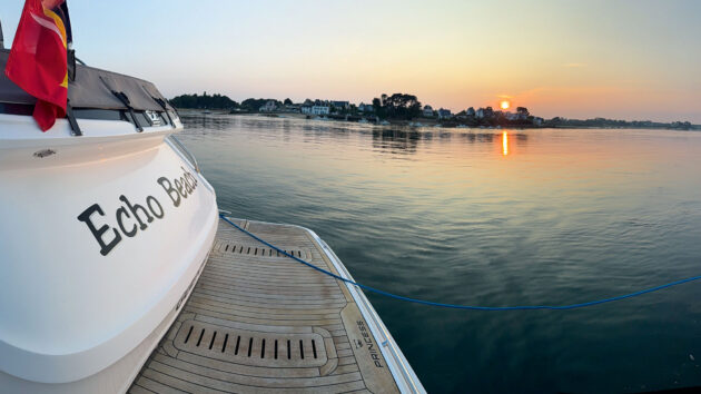 Watching the sun set over the bathing platform of their Princess V50 on the River Étel 