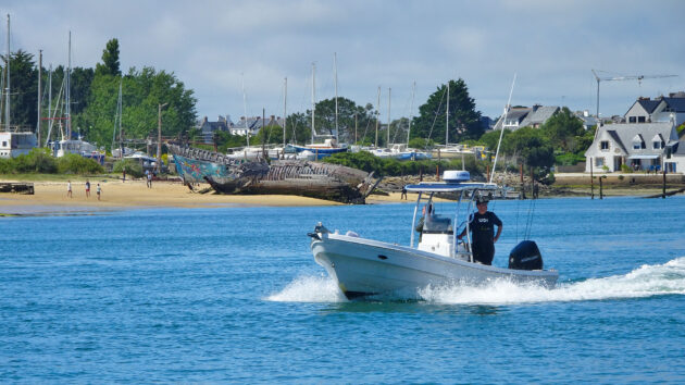 One of the many small fishing boats whizzing in and out of the entrance to the river