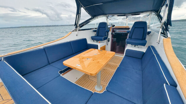 Wraparound bench seating in blue with table in the middle