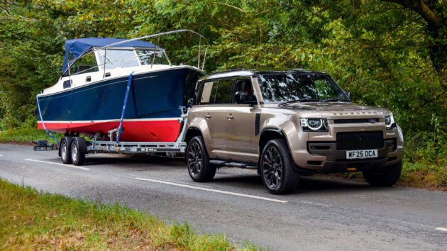 Duchy 25 on a trailer behind a 4 by 4 car