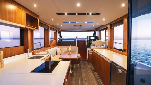 Drop-down windows make for a bright, airy saloon and galley