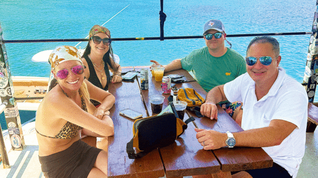 Tucking into Pain Killer rum cocktails on Willie T’s top deck