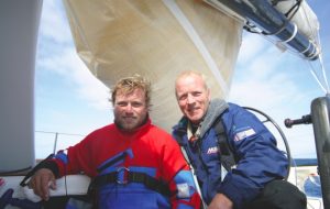 Alex Thomson safe with Mike Golding, still in his survival suit