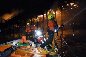 Firefighters tackle a blaze on Hastings Pier from all-weather lifeboat