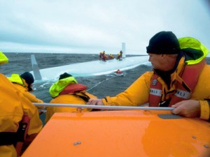 RNLI lifeboat approaches capsized yacht