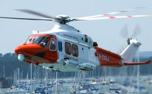 Coastguard helicopter over marina