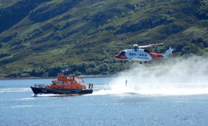 RNLI Lochinver lifeboat with Coastguard helicopter