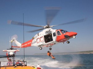 Coastguard helicopter on exercise with RNLI off Dorset