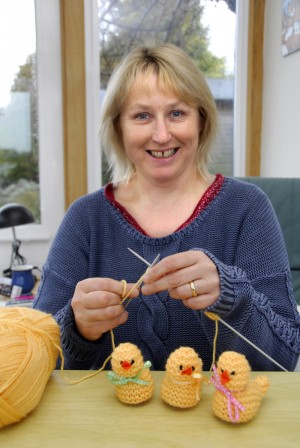 Pip Rowntree knitting her Easter chicks. Credit RNLI/Dave Barry