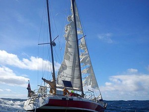 The storm battered yacht ith its sails in tatters, which was rescued off Sennen Cove. Credit- RNLI-Elliot Andrews