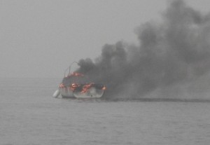 The burning boat as the Littlehampton RNLI lifeboat approached