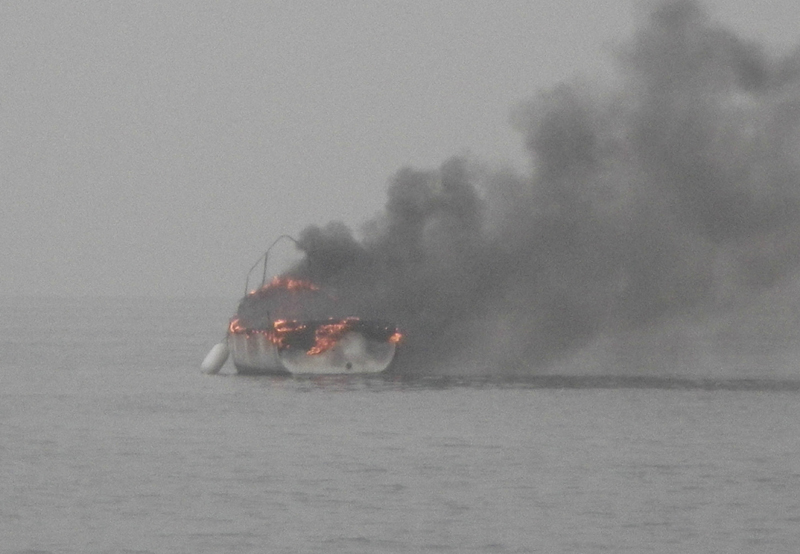 The burning boat as the Littlehampton RNLI lifeboat approached