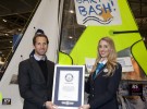 Sir Ben Ainslie one of the founding trustees of the Andrew Simpson Sailing Foundation accepts the certificate from Guinness World Record adjudicator Elizabeth Smith at a ceremony at the CWM FX London Boat Show