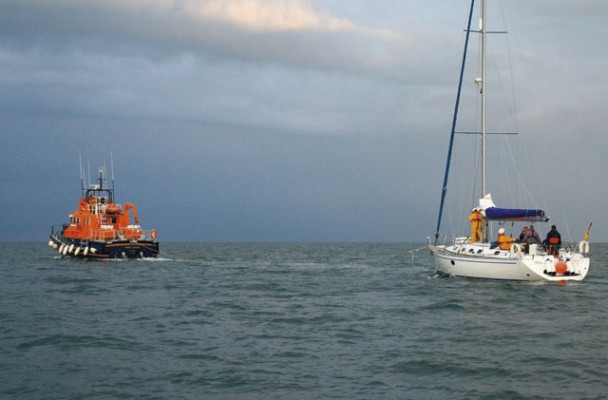 Lifeboat towing yacht