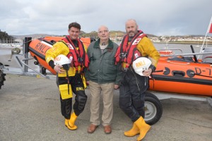 RNLI crew members Greg Donald and Pete Hughes with David Stocks