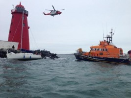 Grounded yacht rescue at the entrance to Dublin Port, Ireland. Credit: RNLI/Dun Laoghaire