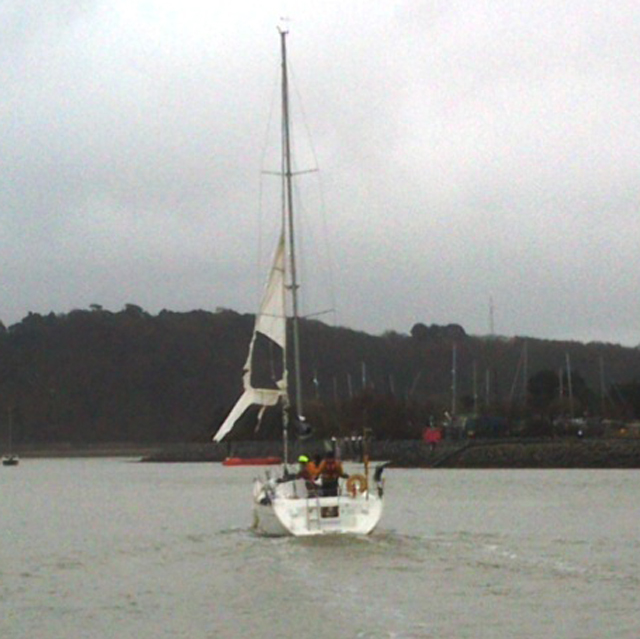 The yacht approaching the safety of Conwy Marina with two RNLI crew aboard with the owner. Credit: RNLI