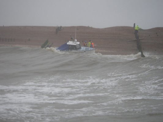 Cabin Cruiser aground off the Mary Stanford Lifeboat House at Winchelsea Beach. Credit: RNLI Rye Harbour/Tim Dickinson