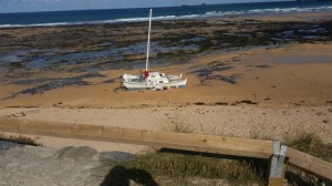 Grounded catamaran at Constantine Bay. Credit: Damion Gough