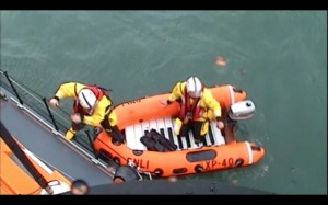 Howth RNLI volunteers try to reach the grounded yacht on Lambay Island. Credit: RNLI/Noel Davidson