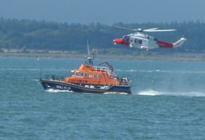 Yarmouth Lifeboat with the Search and Rescue Helicopter. Credit: RNLI/Claire Hallett