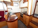 Tug Yacht 33 - the well-equipped galley includes a gas oven, hob and grill