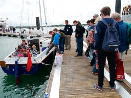Visitors line up to step aboard the PBO Project Boat Hantu Biru at the 2015 Southampton Boat Show