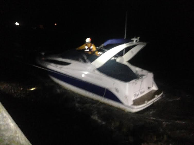 An RNLI crewman on the stricken Bayliner. Credit: Paul Lovesy