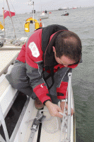 1. Starting from the midships cleats, we rigged a bridle, running aft...