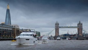 Princess yachts sailing past Tower Bridge and the Shard on their way to ExCeL London for the 62nd London Boat Show