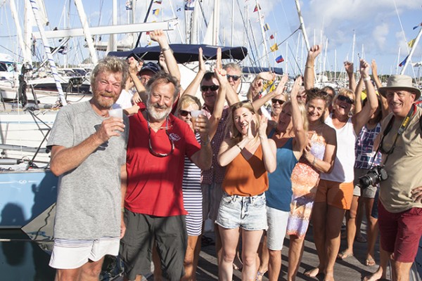 The Contessa 32 Pisces crew Paul Thompson and David Everett being greeted with rum punch in St Lucia. Credit: Clare Pengelly/World Cruising Club