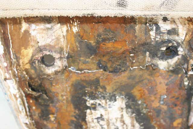 3: The real damage can be seen in the underside of the hull where cracks are obvious around the bolt holes. Rust is again caused by water ingress