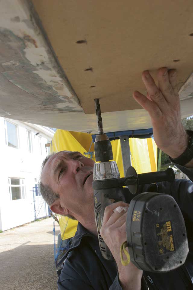 3: Using a template he made from the flange Andy re-drills the keel holes