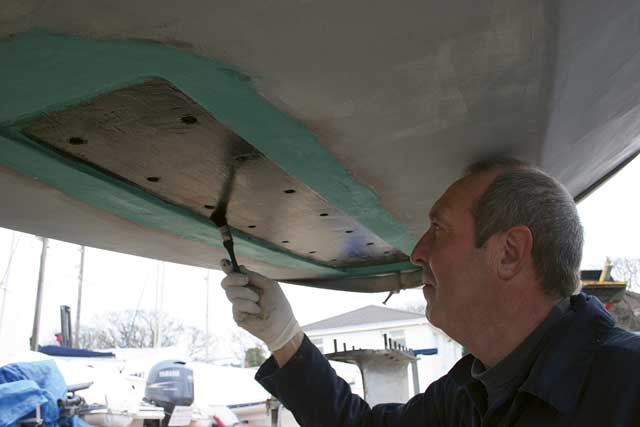 2: Andy coats the keel recess in Sikaflex primer and leaves it to dry for an hour