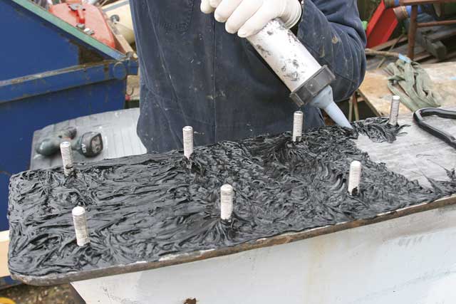 3: After ensuring the keel and hull are dry and free of dust, Andy applies a generous amount of Sikaflex with a gun. ‘It should ooze out everywhere. If it doesn’t it may indicate a hole,’ he says. The excess Sikaflex can be trimmed away the following day once it’s dry, then cleaned with Sika cleaner or white spirit