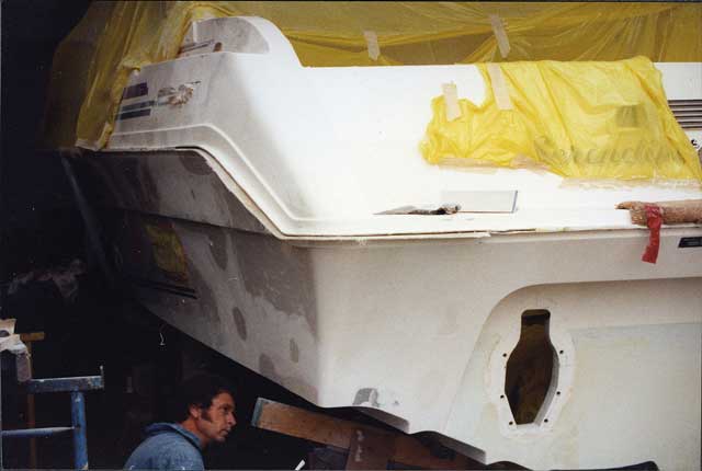 4 White gel coat is carefully colour-matched then applied from the inside of the boat, followed by layers of chopped strand mat to build up the thickness of the hull again. Stringers and other strengthening are also replaced. Once the moulds are released, final colour matching takes place with a finishing coat, applied from the outside.