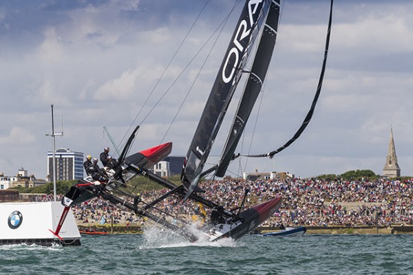 Oracle Team USA fly out the water in front of the Portsmouth crowd. Credit Ian Roman