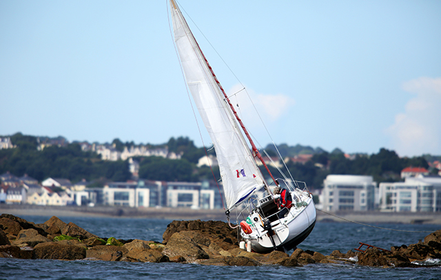 French yacht aground on Brehon Tower rocks. Credit: Peter Frankland