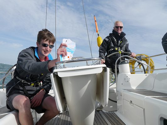 James studying flashcards to memorise aids to navigation