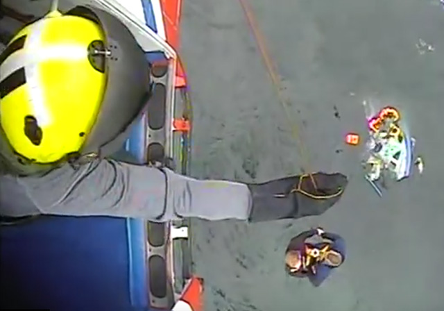 Coastguard helicopter rescues five men from sinking boat