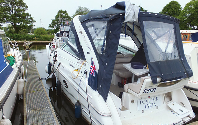 Love for Lydia alongside a marina following the accident-canopy as found