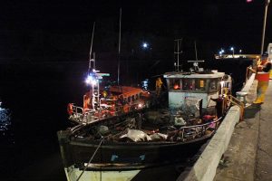 The converted fishing trawler safely in Peel harbour. Credit: RNLI/Mal Kelly