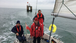 People on a deck of a boat winter sailing