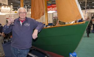 Stewart Brown celebrates the past and maps out the future of Drascombe as they celebrate 50 years of business at the the London Boat Show 2017. Credit: onEdition