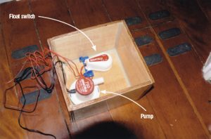 A sump box fitted with a float switch allows the shower to drain without the pump having to run continuously while showering