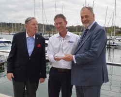 Stephen 'Sparky' Park is presented with a boats.com/YJA Special Award for services to the sport of sailing at the Royal Southern Yacht Club Hamble this week. The award was presented by Barry Pickthall, Chairman of the Yachting Journalists' Association (right) and former Chairman Bob Fisher. Credit: www.pplmedia.com
