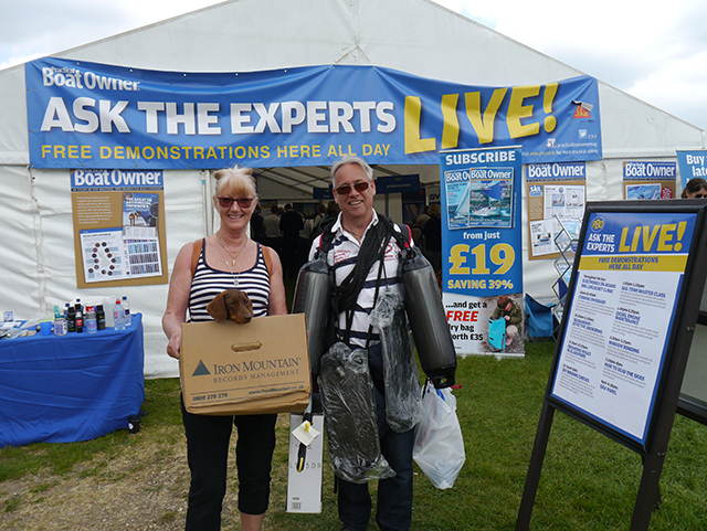 Bernie and Mike Wrankmore and miniature dachshound Elsa outside the PBO Ask the Experts Live marquee