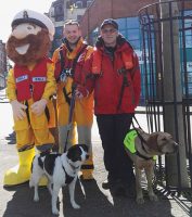The RNLI’s Stormy Stan pictured with sailor Chris Egan and Brian Curtin, RNLI Community Fundraising Manager and Valentia RNLI crew member. Credit: RNLI/Len Lloyd