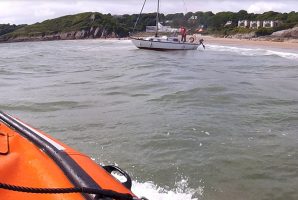 Yacht aground at Langland Bay. Credit: RNLI/Andy Miles